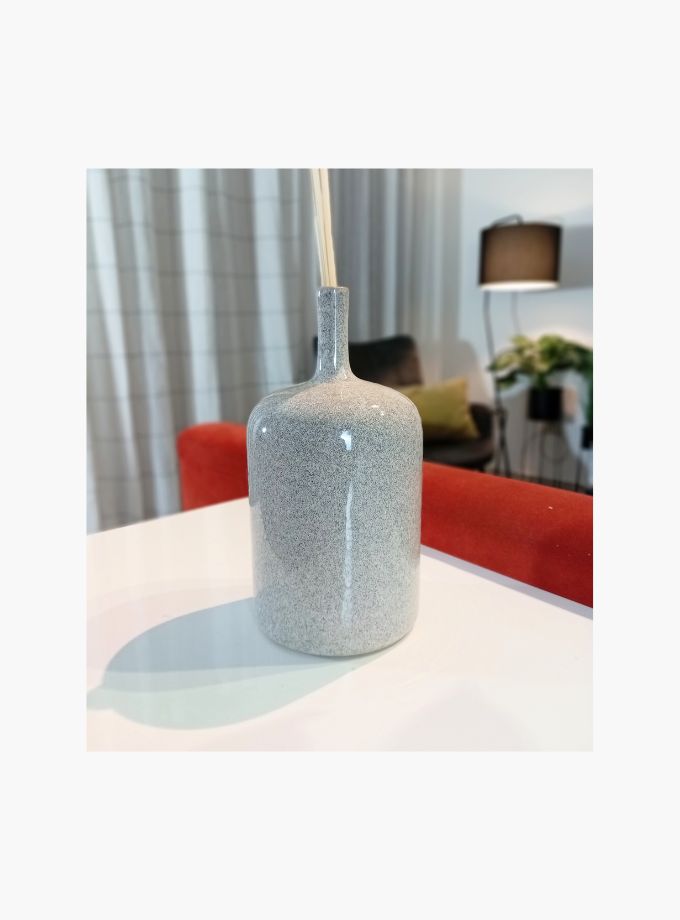 Ceramic bottle vase with pampas